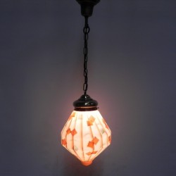 Art Deco hanging lamp with angled glass shade burning